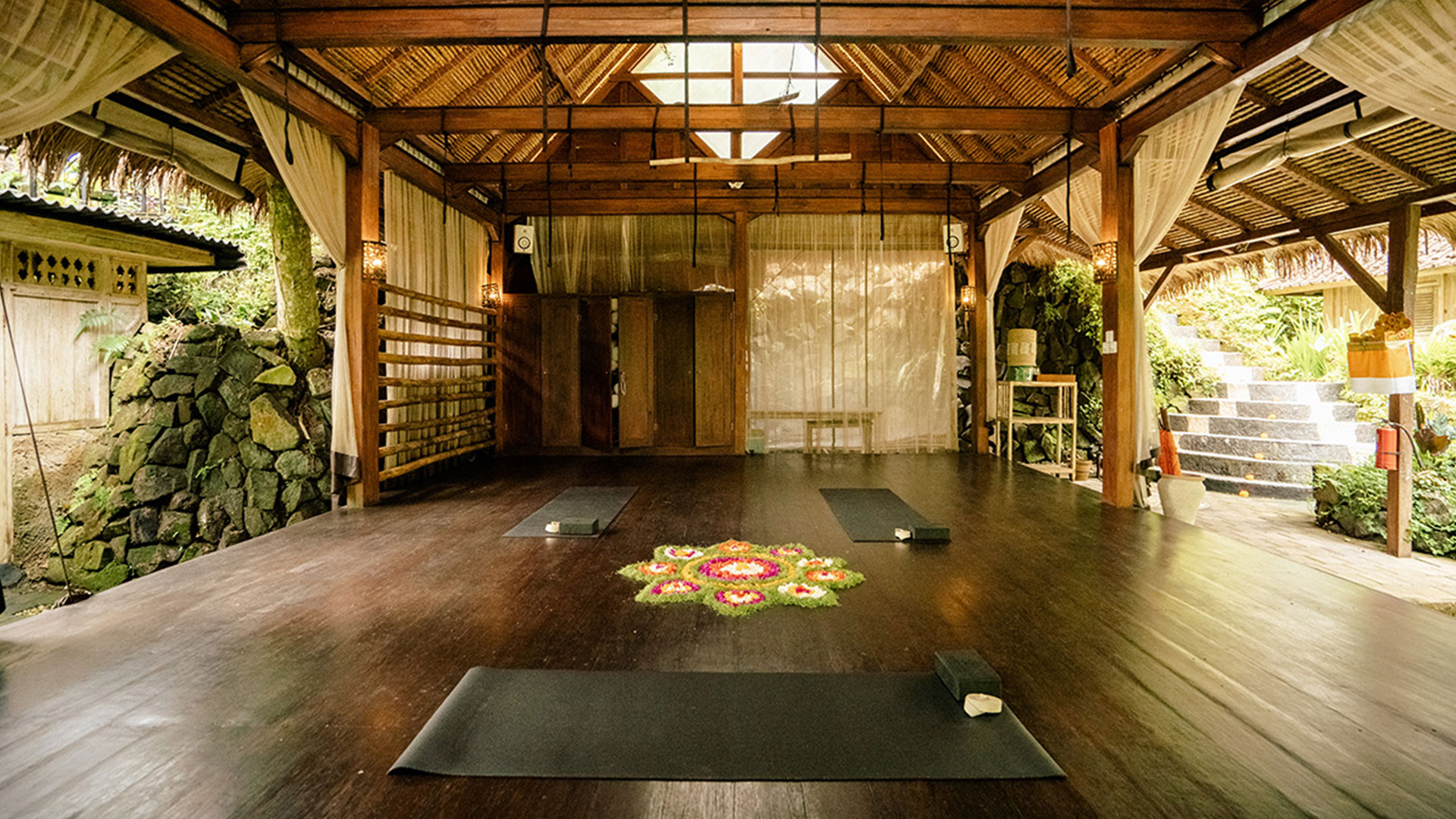 By practicing twice daily yoga and meditation receiving two complementary blissful massages, lounging by private pools, and luxuriating in stunning accommodation surrounded by jungle and rice paddies, you'll surrender into a state of total bliss.